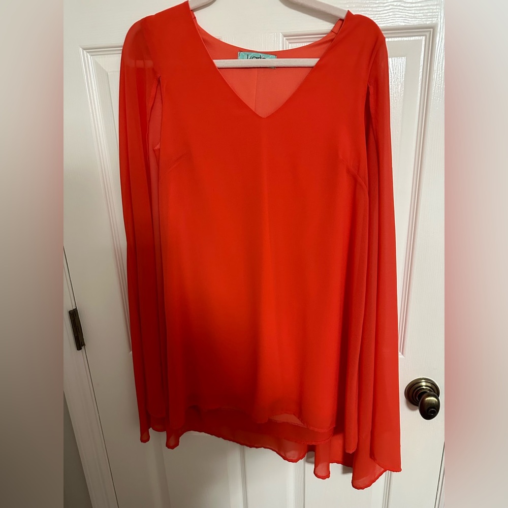 KARLIE orange mini dress with sleeves like a cape.